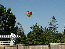 Balloon taking off in back...
