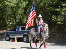 A patriotic girl and her horse.