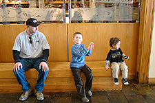 Daddy let the boys pick out a goody in the gift shop.