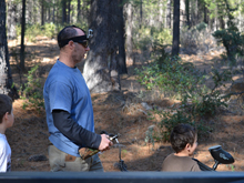 Dave and the boys shooting the paintball gun.