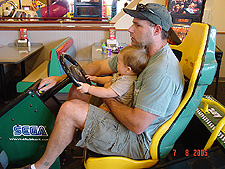 Dave and Hunter play a racing game.