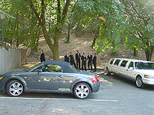 Groomsmen celebrate with champagne.