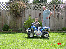 Hunter riding his ATV