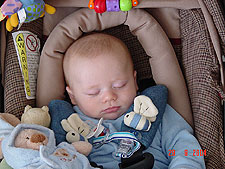 Sleeping with his toys