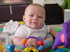 Hunter gets to play in the exersaucer.