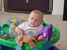 Hunter is proud of himself because he is big enough to play in his saucer.