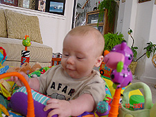 Taking a call on his cell phone...