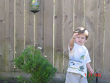 Hunter showing a flower he picked.