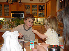 Jordan feeds Tyler part of her cookie.