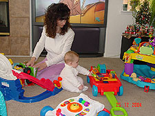 Playing with his new wagon and blocks.