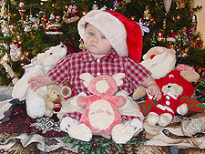 Hunter surrounded by some of his stuffed friends.