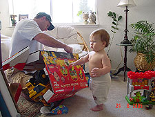 Dave helps Hunter open his Lion King Activity Car.