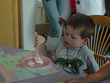 Hunter a eating cake.