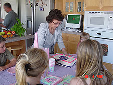 Sylvia cuts the cake.