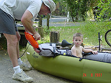 Dave gets the boat ready while Hunter tests it out