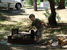 Ryder helps get the fire ready.