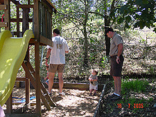 Hunter and Dave by the swingset.