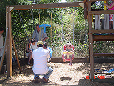 Olivia in the swing.