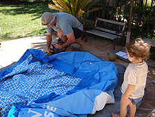 Getting raedy to inflate the pool.