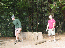 Dave and Ken play horseshoes.