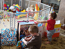 Hunter helps Ryder open gifts.