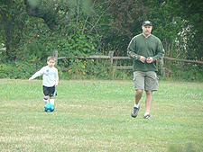 Hunter warming up with dad