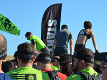 Dave going over the first wall to get to the starting line.