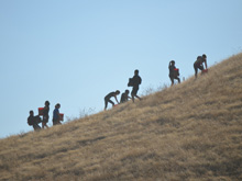 Carrying buckets of rocks