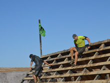 Dave coming over the last wall before the finish.