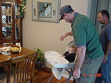 Dave gets Hunter ready in the high chair.
