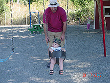 Dave gives Hunter a ride in the swing.
