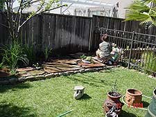 Heidi planting herbs.