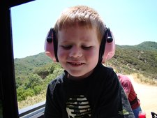 Hunter wearing mom's ear protectors