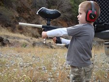 Hunter shooting his paintball gun.
