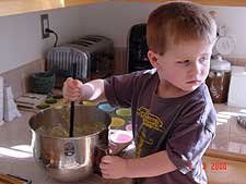Hunter mixing the batter.
