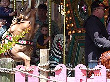 Dave and Hunter on the carousel