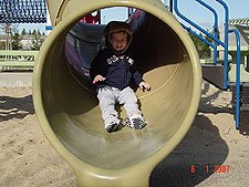 Hunter going down the slide.