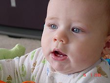 Hunter showing his two teeth coming in.