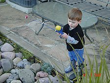 Hunter practice fishing in the pond.