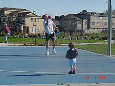 Hunter and daddy play with the basketball.