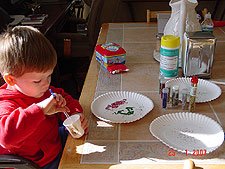 Hunter making pictures with glitter.