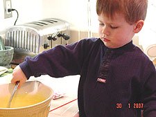 Hunter stirs the cake mix