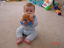 Hunter chewing on his monkey