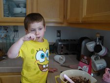 Hunter tasting the batter.