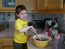 Hunter mixing the batter.