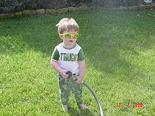 Hunter playing with the hose.