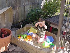 Hunter playing in his sand box.