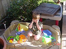 Hunter playing in his sand box.