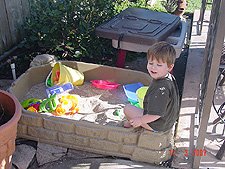 Hunter playing in his sand box.