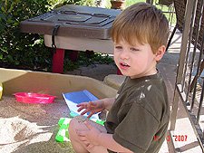 Hunter playing in his sand box.